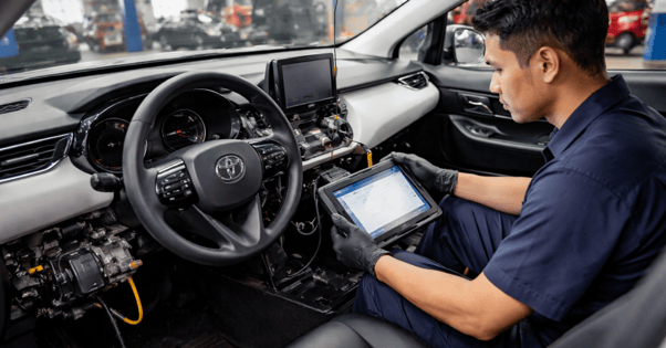 technician performing airbag module reset for Toyota