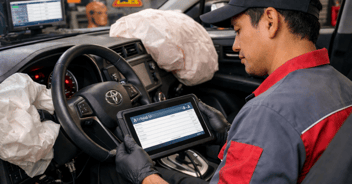 technician fixing Toyota airbag